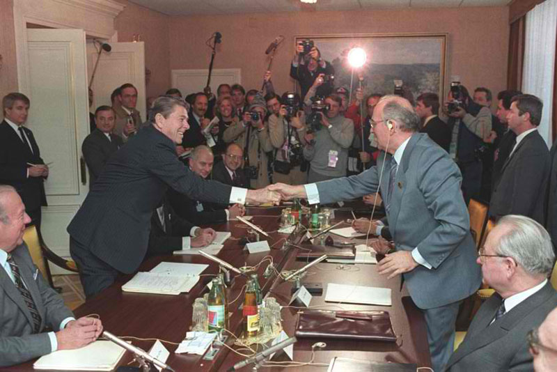 Reagan and Gorbachev exchange a Masonic handshake to end their contrived conflict.