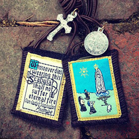 The Scapular acts as a Mark of Our Lady, specifically for those who are marked with the names of the Masonic Trinity, the Father, son, and the holy spirit. The mark of Our Lady overrides these errors for those who are naive to the end-times apostasy.